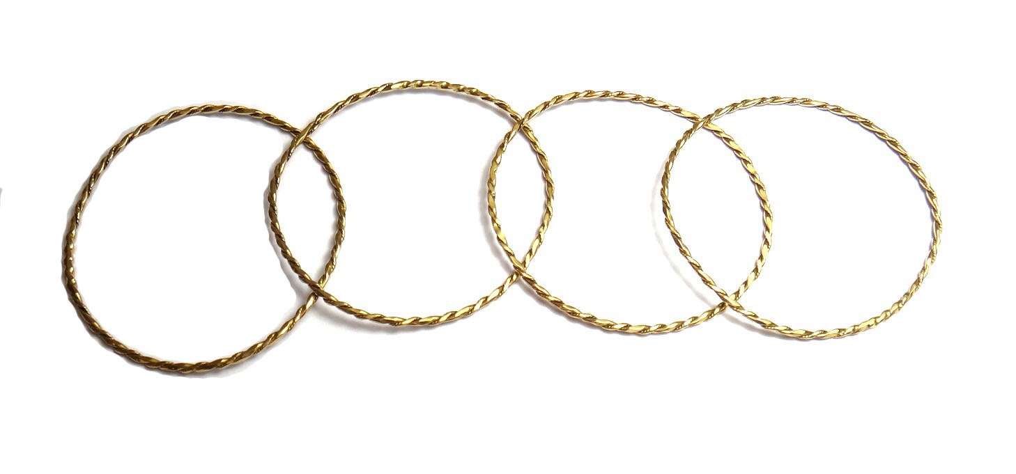 Appraisal: Four Sudanese gold wire work bangles each in a circular