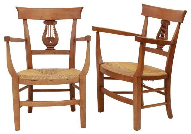 Appraisal: pair Petite Empire style fruitwood chairs early th c shaped