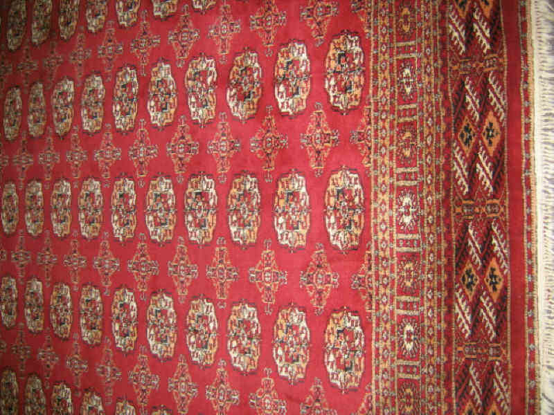 Appraisal: BOKHARA ROOM RUG The red field with five rows of