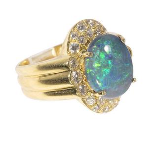 Appraisal: Black opal diamond and k yellow gold ring Black opal