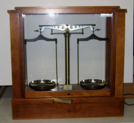 Appraisal: VOLAND SONS BALANCE SCALE Brass within a cherry and glass