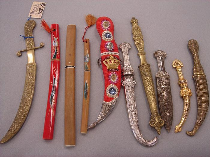 Appraisal: Lot of vintage letter openers in sheaths Including wooden oriental