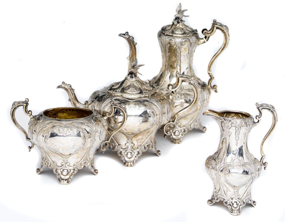 Appraisal: A VICTORIAN TEA AND COFFEE SERVICE of melon form embossed