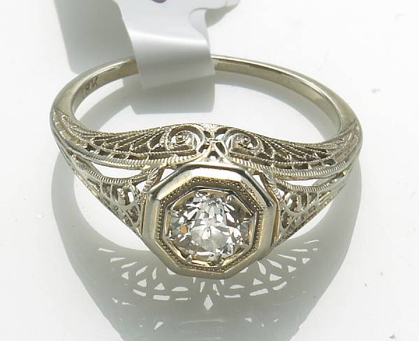 Appraisal: A diamond and k white gold filigree ring