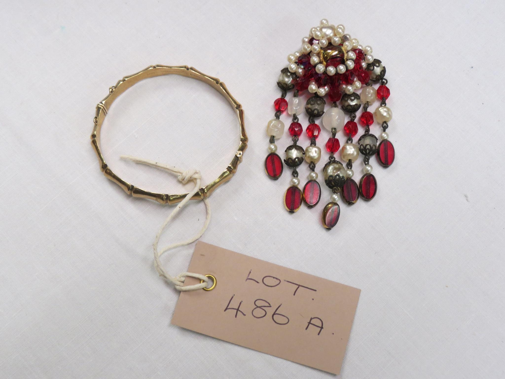 Appraisal: A ct gold bangle and a pearl-type drop brooch