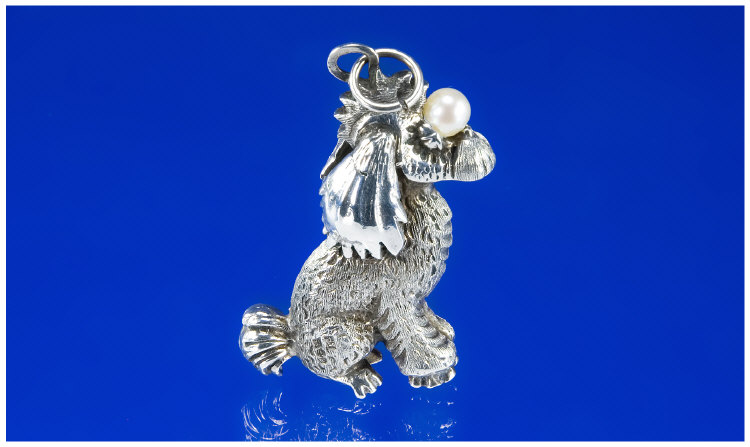 Appraisal: Silver Pendant in the Form of a Poodle This glamorously