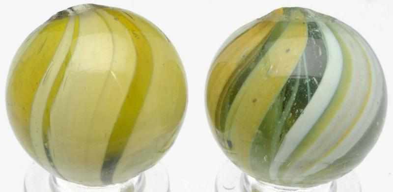 Appraisal: Lot of Banded Transparent Marbles First marble has an olive