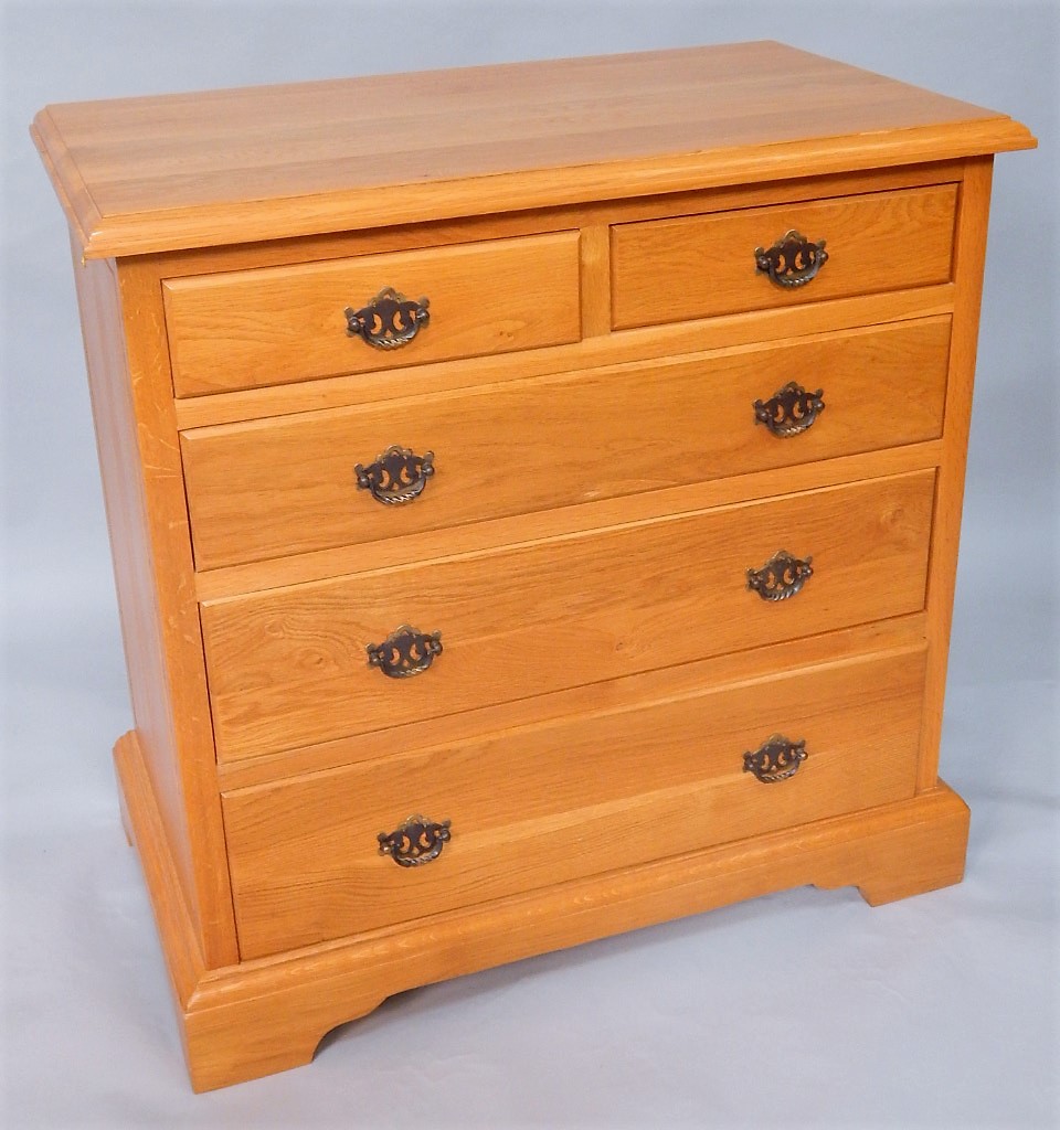 Appraisal: A light oak chest of two short over three long