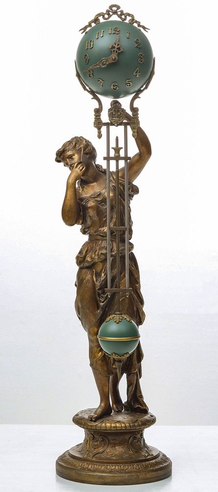 Appraisal: ANSONIA 'JUNO' BALL SWING SPELTER FIGURAL MYSTERY CLOCK The figure