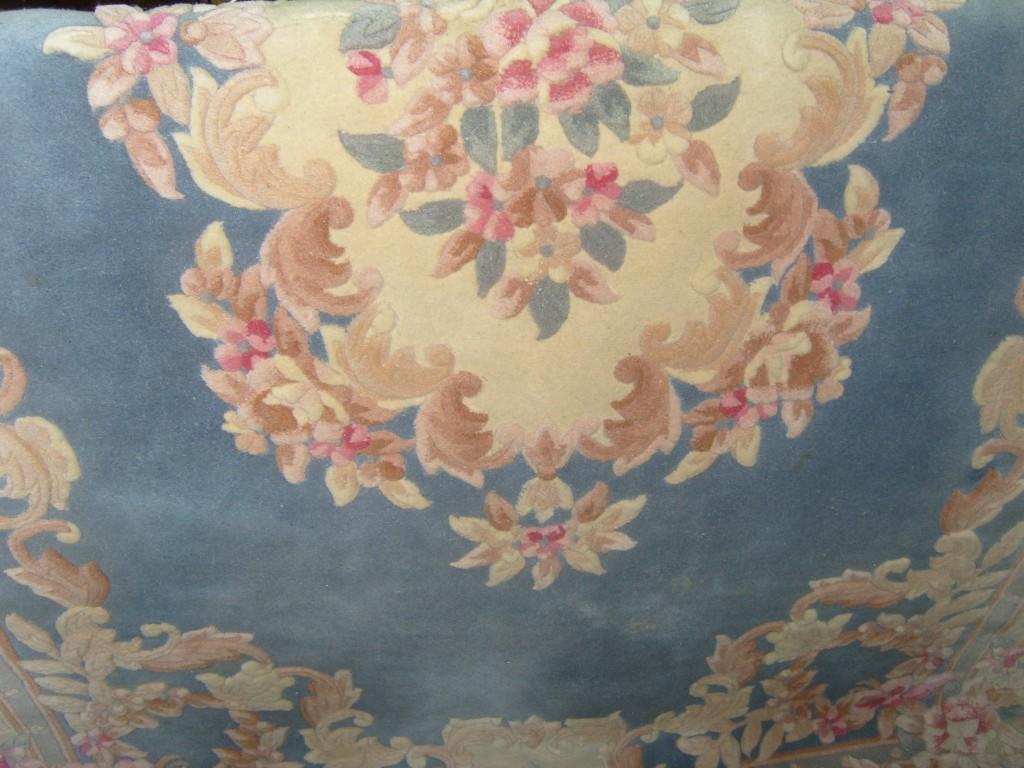 Appraisal: A Chinese wool rug with pink cream and brown decoration