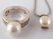 Appraisal: A silver faux pearl and paste ring by Tomas Sabo