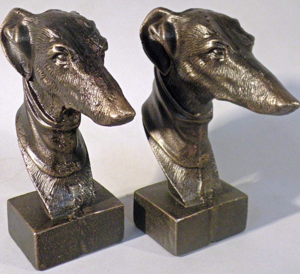 Appraisal: Two cast greyhound heads cm high