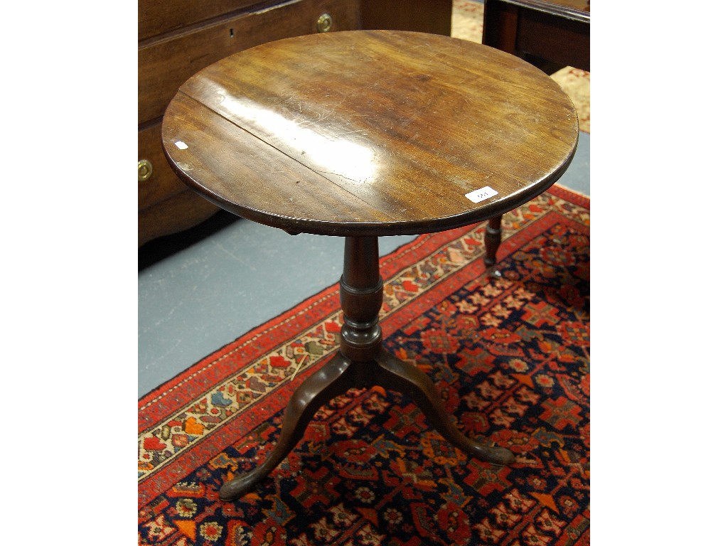 Appraisal: A George III mahogany circular tip-top tripod table raised on