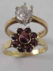 Appraisal: A yellow metal tests carat gold garnet ring together with