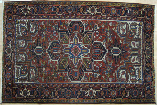 Appraisal: Heriz carpet ca with a central medallion on a red