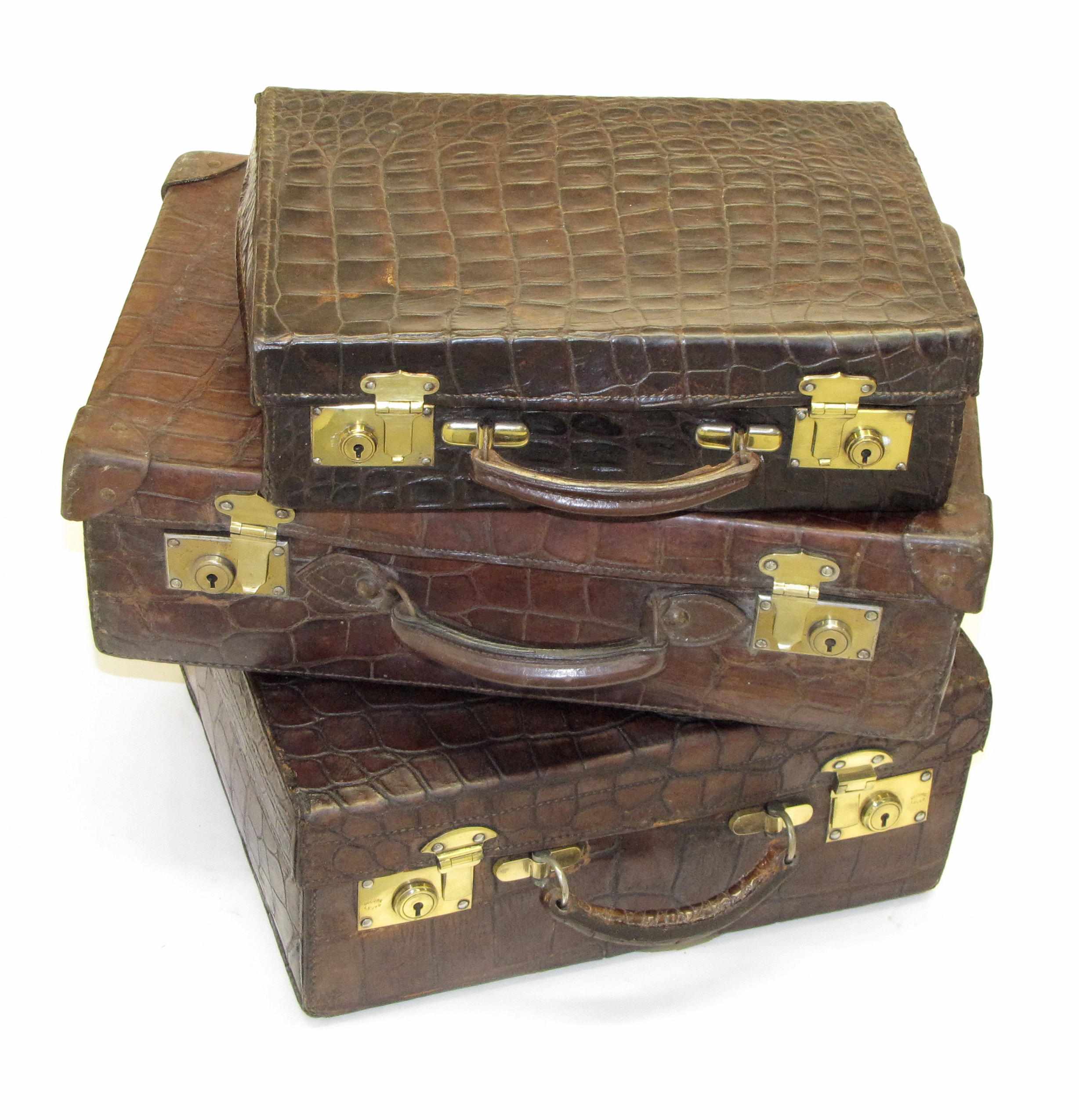 Appraisal: Designer Fashions and AccessoriesProperty of Various Owners Three crocodile suitcases