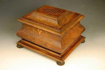 Appraisal: A Victorian walnut work box of sarcophagus shape the lid