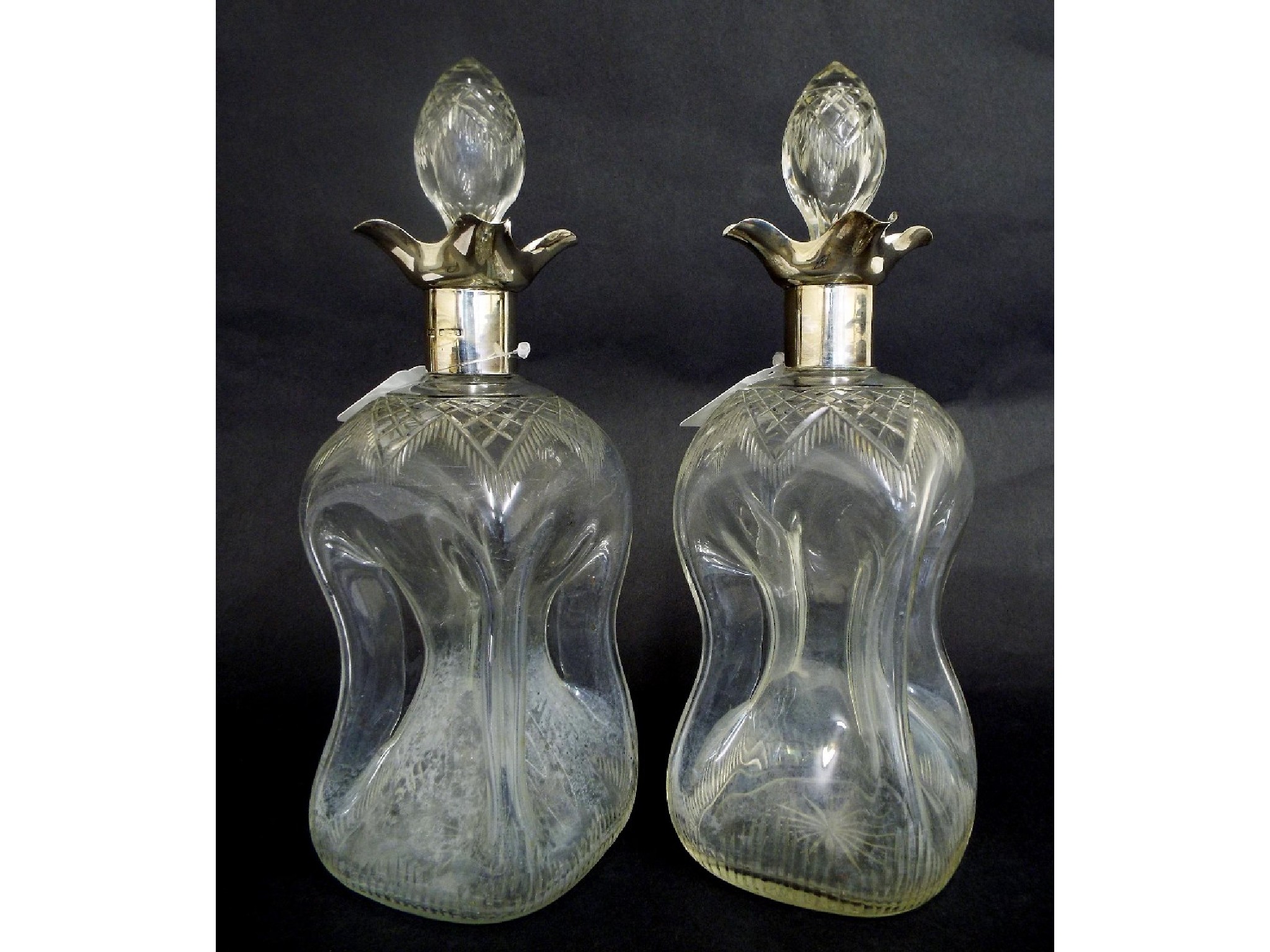 Appraisal: Good pair of silver rimmed glass dimpled decanters with hobnail