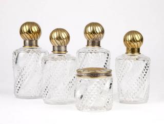 Appraisal: Five Baccarat pressed glass gilt metal vanity bottles Mid th