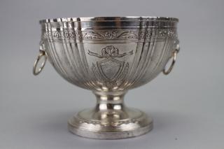 Appraisal: Silverplate Cup with Lion Head Mounts Floral engravings Height in