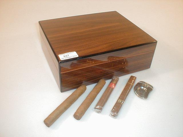 Appraisal: A modern humidor rosewood cigar box cigar cutter and the