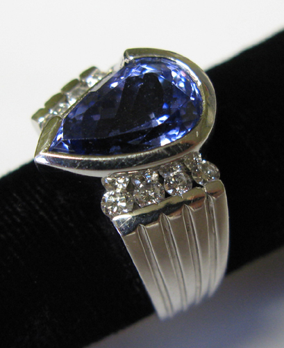 Appraisal: TANZANITE DIAMOND AND FOURTEEN KARAT WHITE GOLD RING WITH APPRAISAL