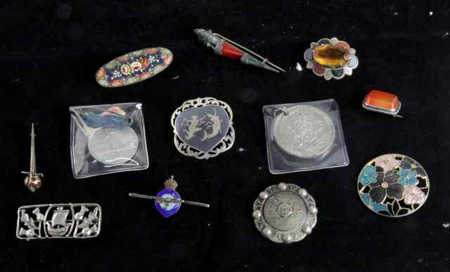 Appraisal: A Scottish silver brooch circa set with polished stones another