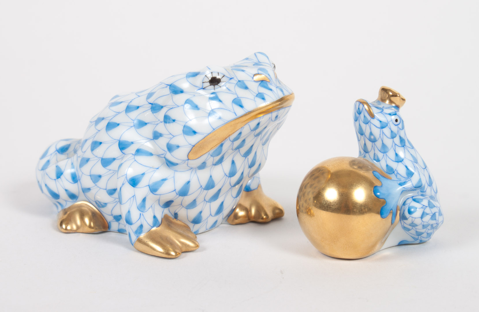 Appraisal: Herend porcelain toad and frog prince blue fishnet pattern sitting