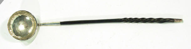 Appraisal: Unmarked Georgian silver sauce ladle with turned ebonized handle cm