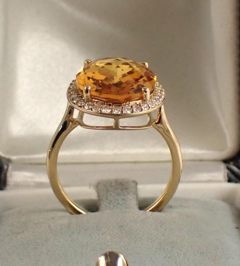 Appraisal: CITRINE DIAMOND AND FOURTEEN KARAT GOLD RING with a diamond