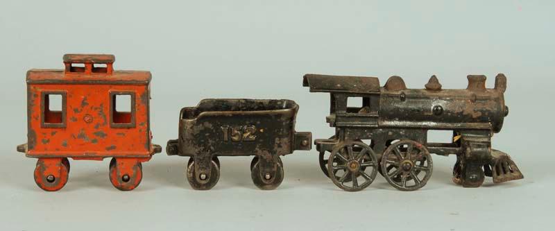 Appraisal: Small Cast Iron -Piece Floor Train Freight Set Description ''