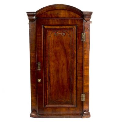 Appraisal: An early th Century walnut arch-top corner cupboard enclosed by