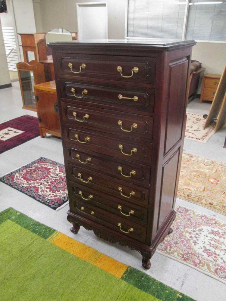 Appraisal: PROVINCIAL STYLE MAHOGANY LINGERIE CHEST having a column of eight