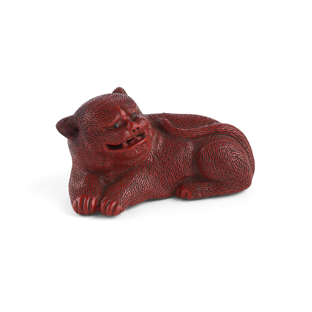 Appraisal: CINNABAR LACQUER FIGURE OF A RECUMBENT LION QING DYNASTY TH