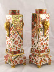 Appraisal: A pair of Japanese square section column vases with elephant