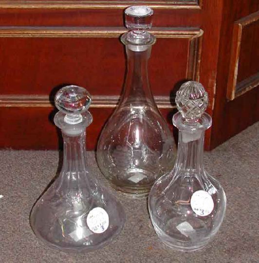 Appraisal: Group of Three Decanters consisting of an English Vintage-engraved glass