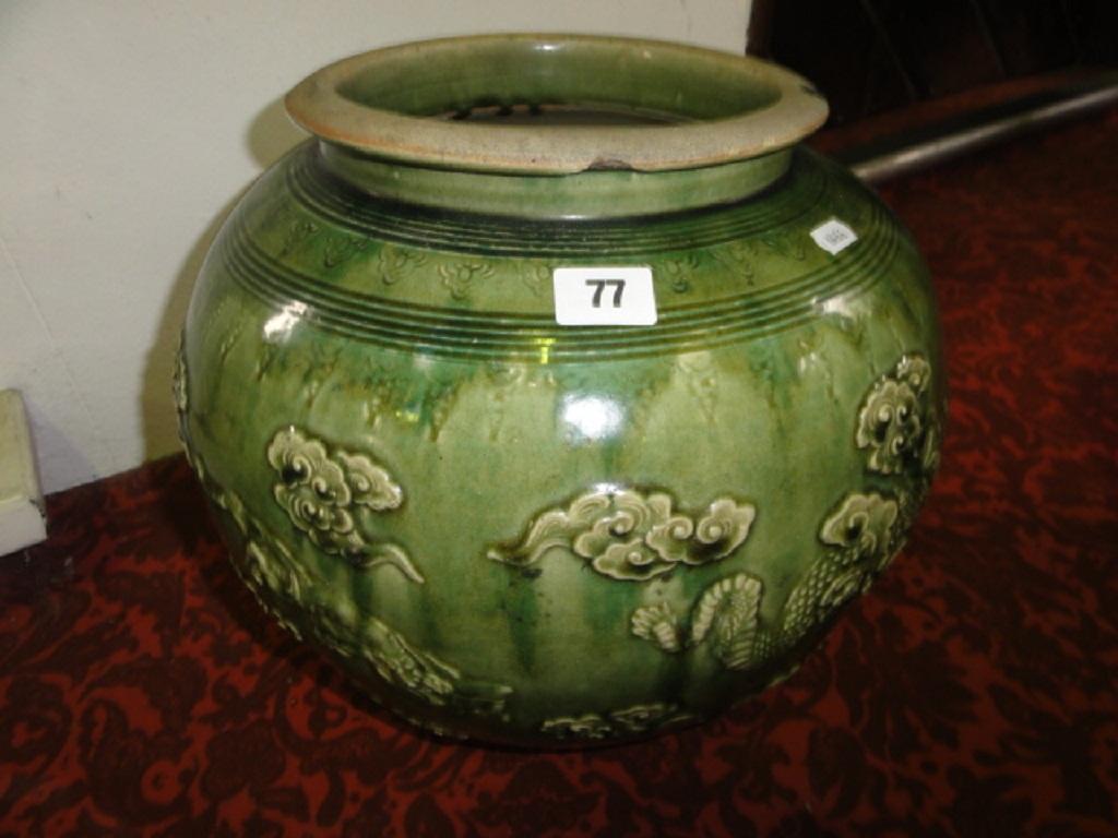 Appraisal: A th century oriental green ground jardiniere with mottled green