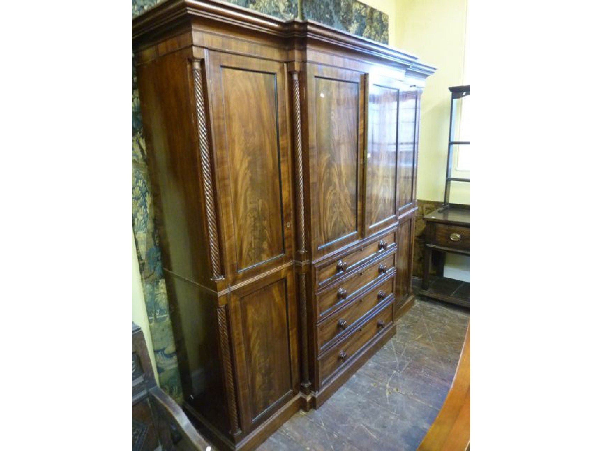 Appraisal: A good quality Regency mahogany -door breakfront wardrobe the central