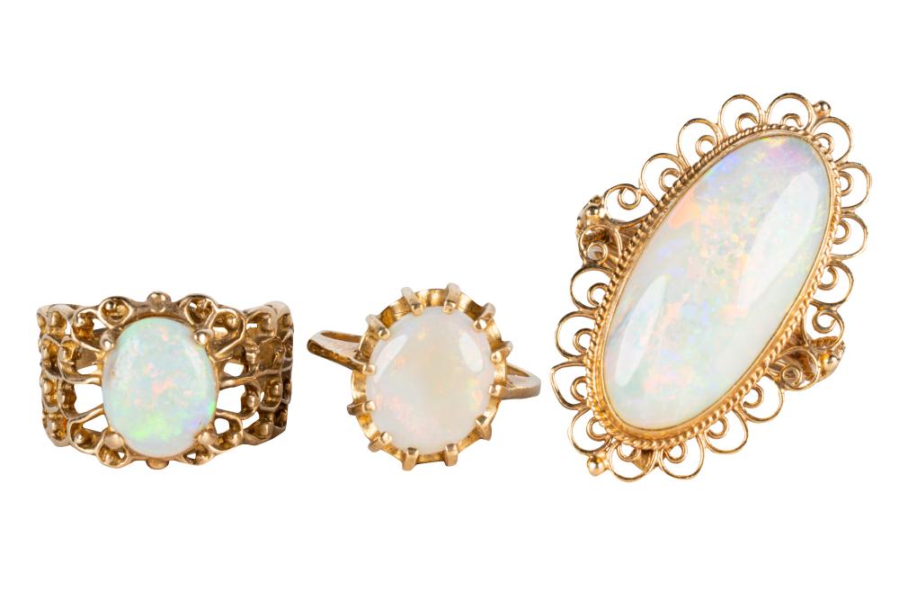 Appraisal: THREE ASSORTED KARAT YELLOW GOLD OPAL RINGSthe large opal ring