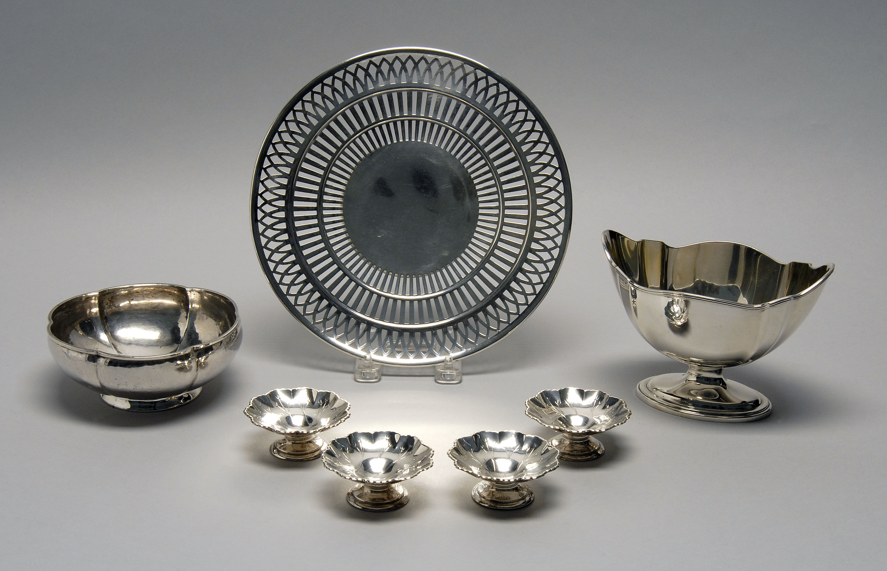 Appraisal: SEVEN PIECES OF STERLING SILVER HOLLOWWARE Includes a sandwich plate