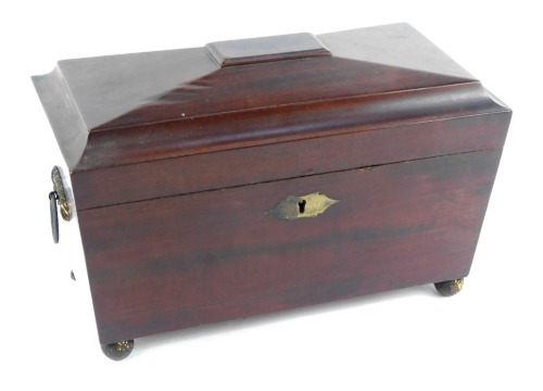 Appraisal: A Regency mahogany sarcophagus shaped tea caddy with ring handles