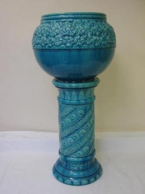 Appraisal: A BURMANTOFTS FAIENCE JARDINIERE of bellied form moulded with flowers