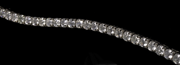 Appraisal: Fourteen-Karat White Gold and Diamond Tennis Bracelet featuring a flexible