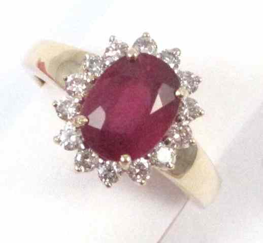 Appraisal: RUBY DIAMOND AND FOURTEEN KARAT GOLD RING round full-cut diamonds