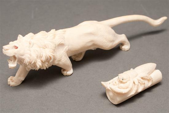 Appraisal: Continental carved ivory lion figure and a Japanese carved ivory