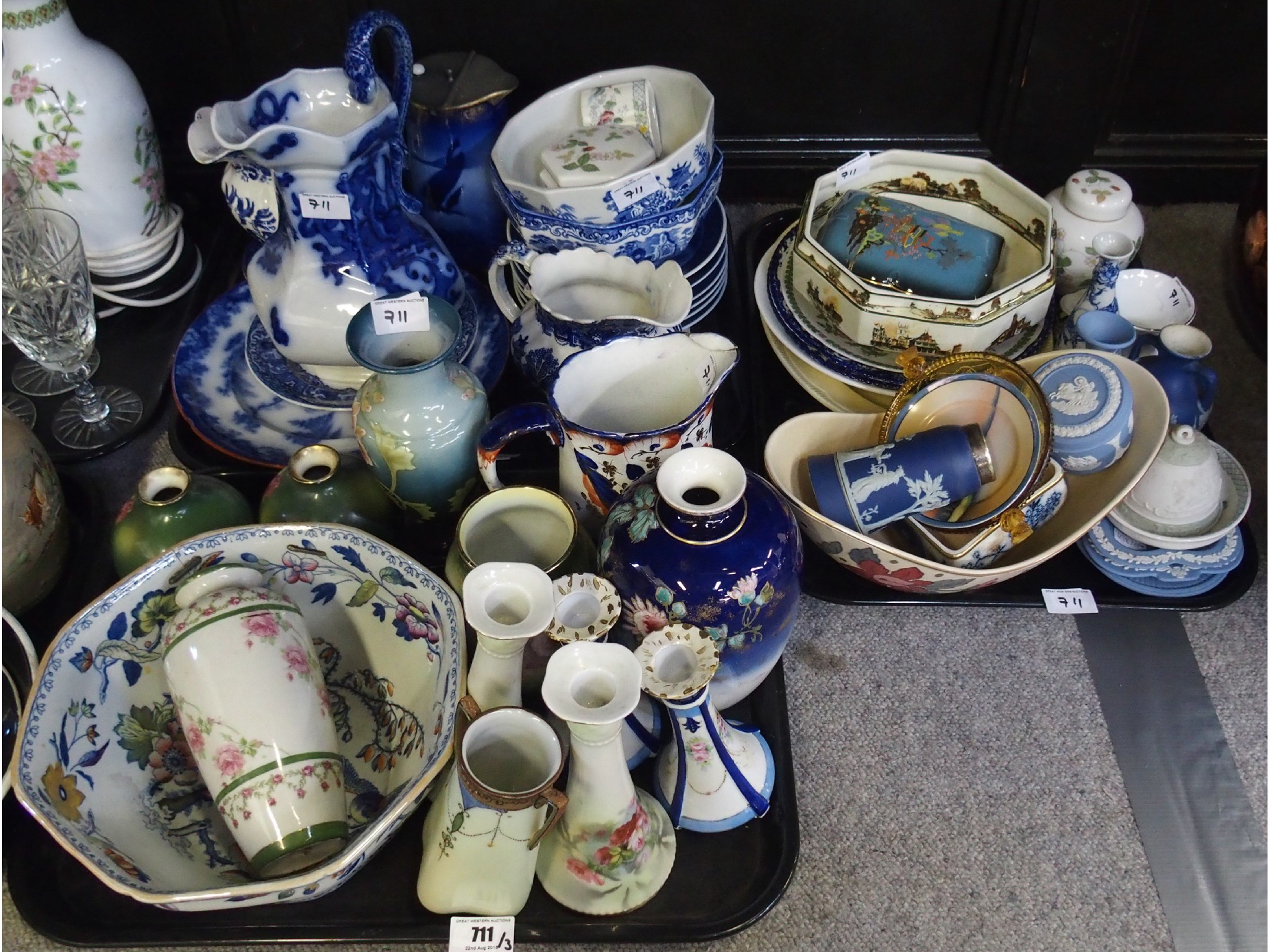 Appraisal: Three trays comprising painted porcelain bud vases blue and white