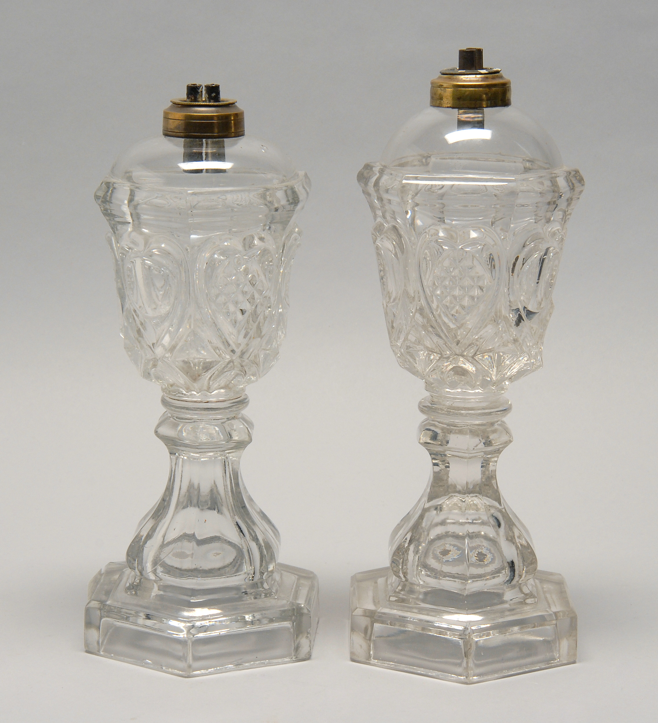 Appraisal: NEAR PAIR OF CLEAR SANDWICH PRESSED GLASS WHALE OIL LAMPS