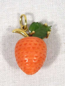 Appraisal: An carat gold pendant set with a coral carved in