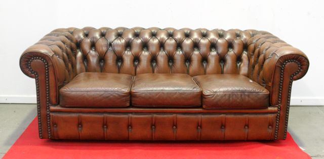 Appraisal: A three-seater leather Chesterfield sofa