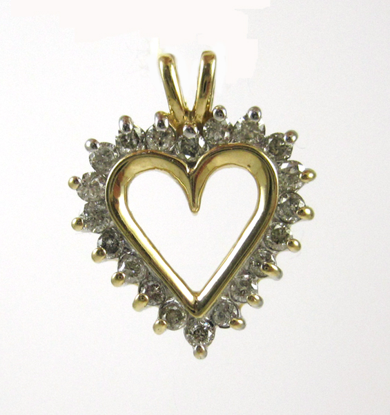 Appraisal: DIAMOND AND FOURTEEN KARAT GOLD PENDANT The open heart pendant